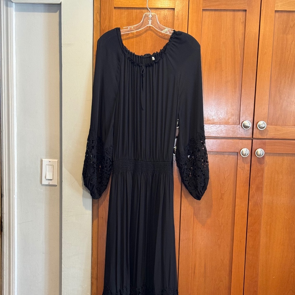 Elie Tahari black dress with lace on sleeves and bottom